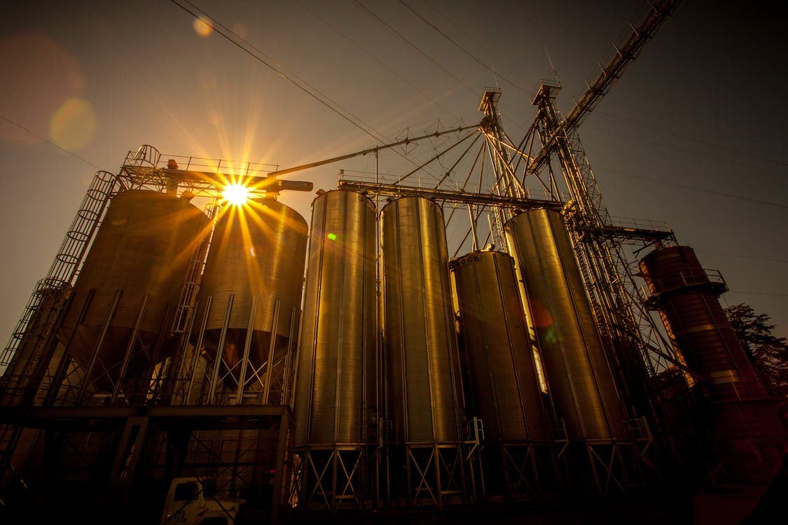 Gas-intensive industrial facility with process piping and tanks